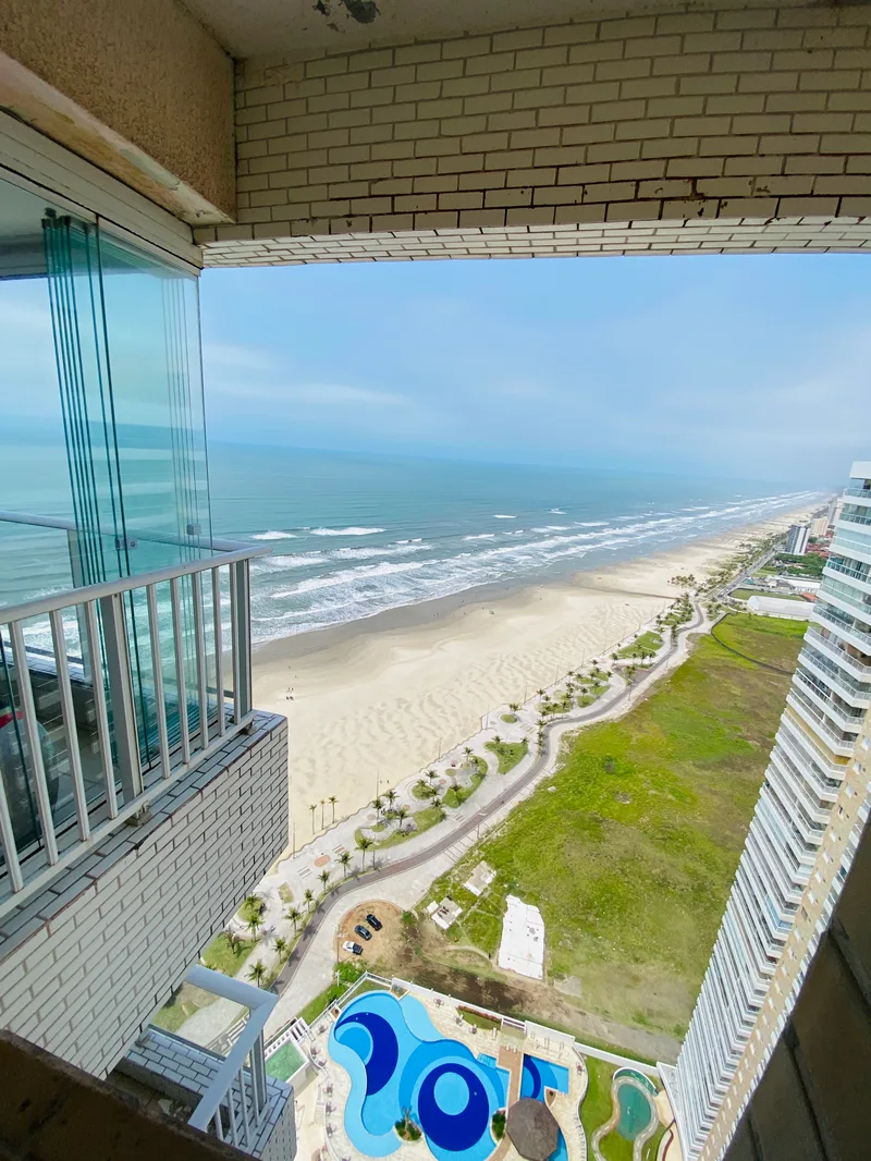 Costa do Sol — 2 dorms com suíte frente mar em Vila Mirim, Praia Grande